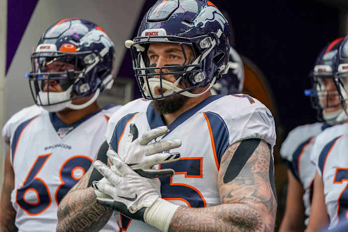 Derek Wolfe stands before a game in his Broncos uniform.